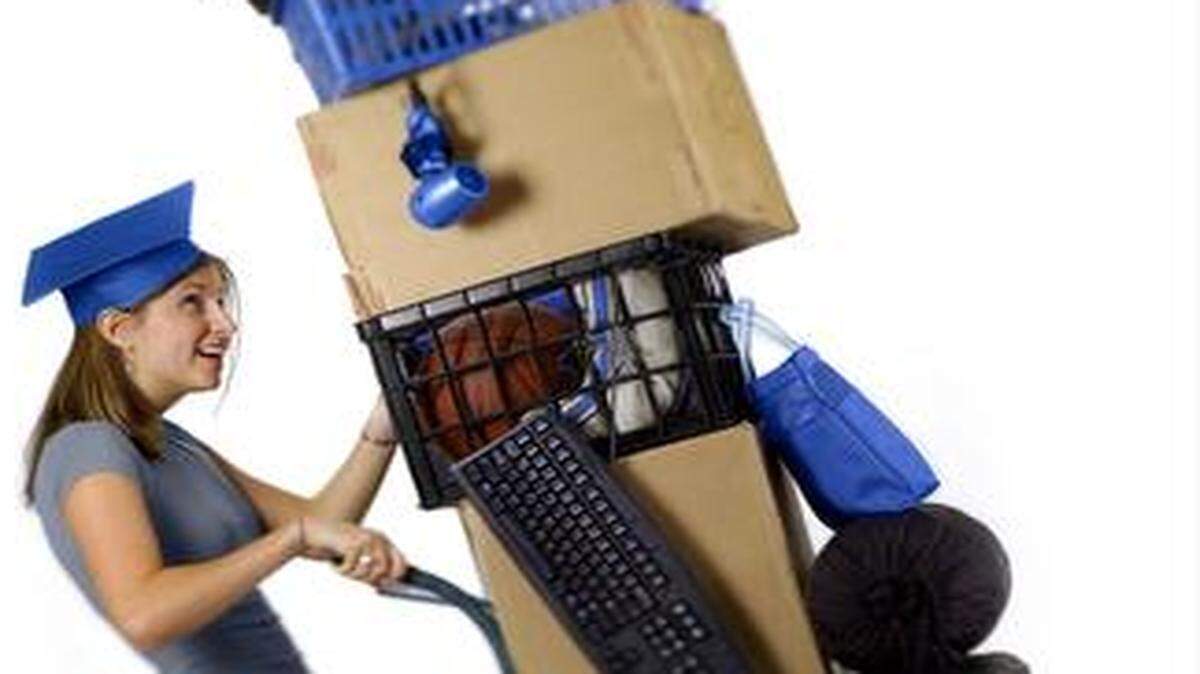 <137>30 May 2003 (jwdorm) Photo by Jim Weber: Illustration for Cindy Wolf story about what recent high school graduates need to be buying over the summer to get ready for dorm life. (against white for text wrap) House & Home. Back to School. Off to college. Freshman. Dorm life. Living on a college campus. Girl wearing graduation cap with cart filled with dorm items. Photo illustration.<137><137><252><137>
