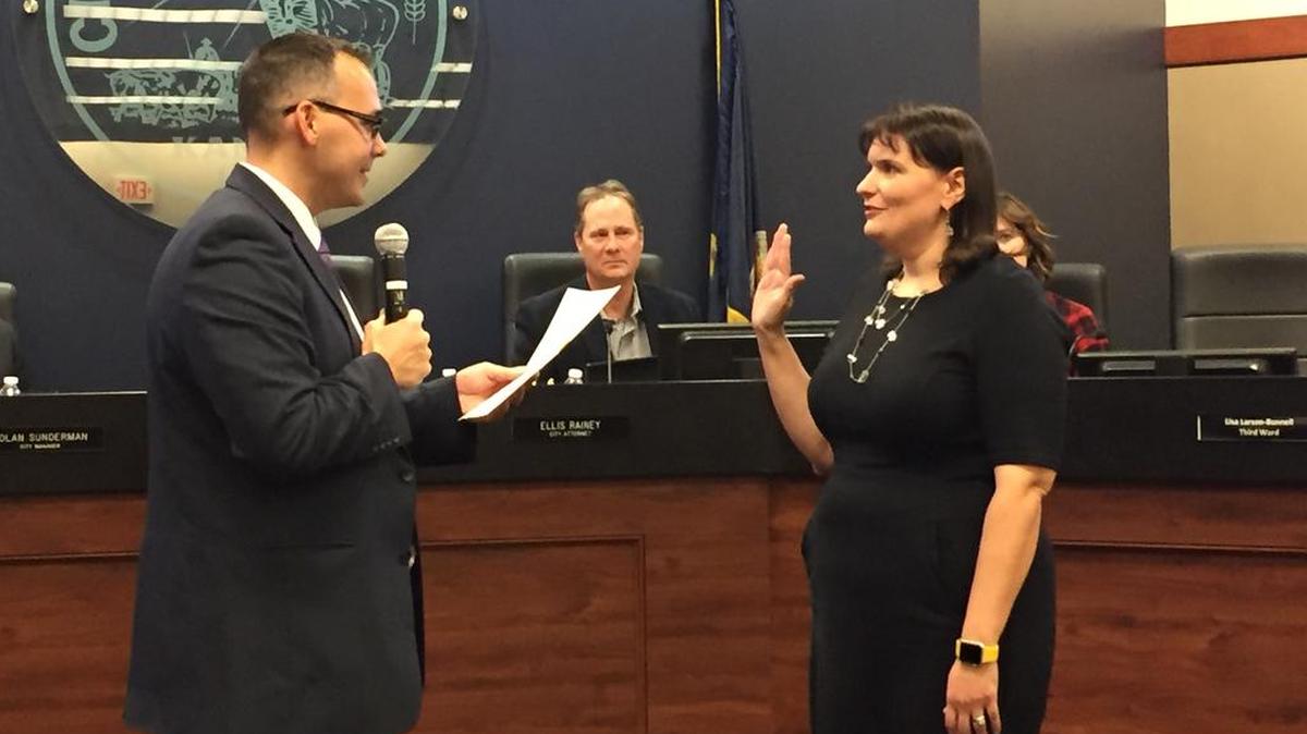 Lisa Larson-Bunnell, right, is sworn into office by Shawnee City Clerk Stephen Powell on Tuesday, Nov. 13, at Shawnee City Hall. The council appointed Larson-Bunnell to fill the seat vacated in September by Justin Adrian.