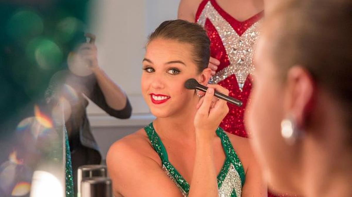 Mindy Moeller, a 2007 Blue Valley graduate, applied makeup with other members of the Rockettes this fall at Radio City Music Hall. Moeller is in her sixth year with the famed precision dance group.
