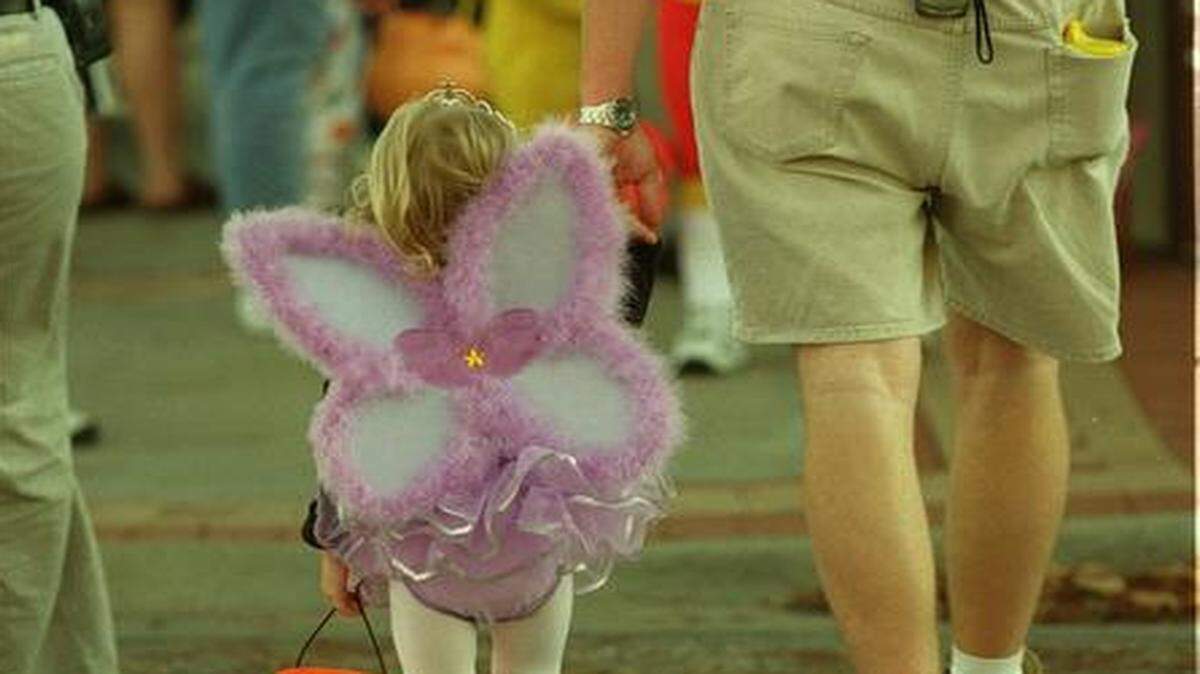 
The merchants of downtown Overland Park provide a safe and welcoming scene for trick-or-treating.


