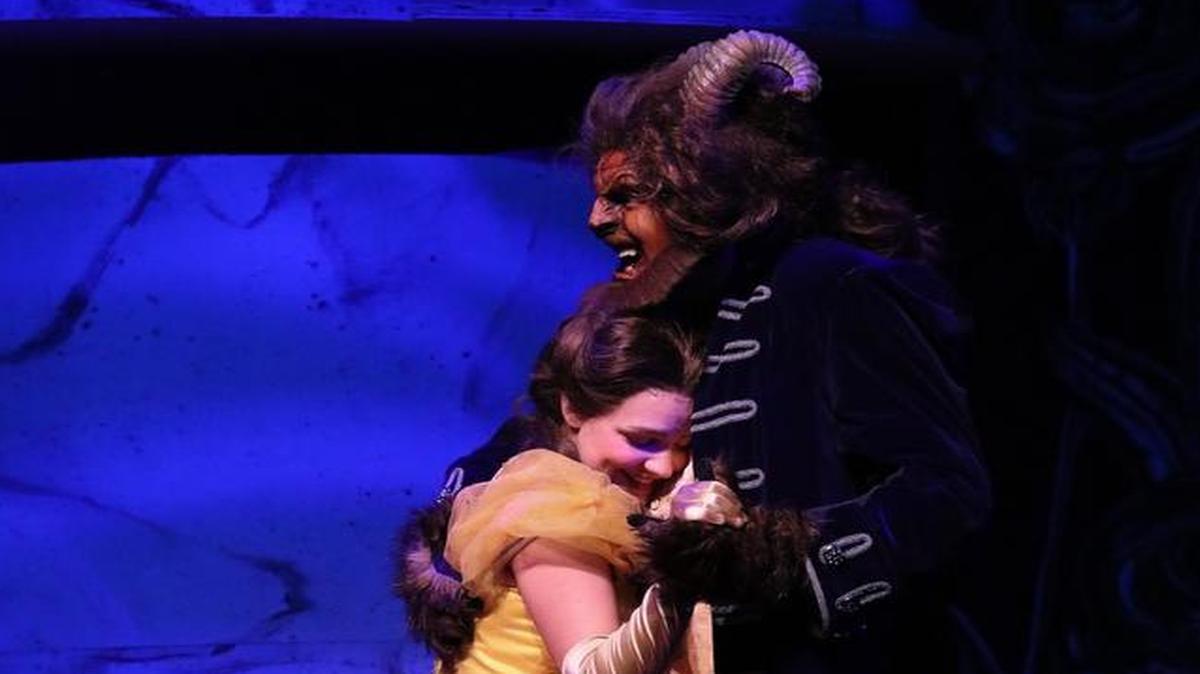 Paris Naster is Belle and the Beast is portrayed by Scott Fagan in “Beauty and the Beast.”