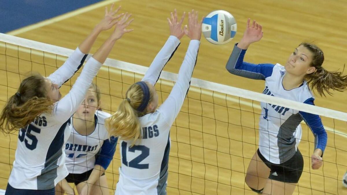 Olathe Nothwest’s Taylor Kuper (right) took a swing against Blue Valley North in this 2015 file photo. Kuper, now a senior, was chosen as the Sunflower League Player of the Year after helping the Ravens to a Class 6A title.