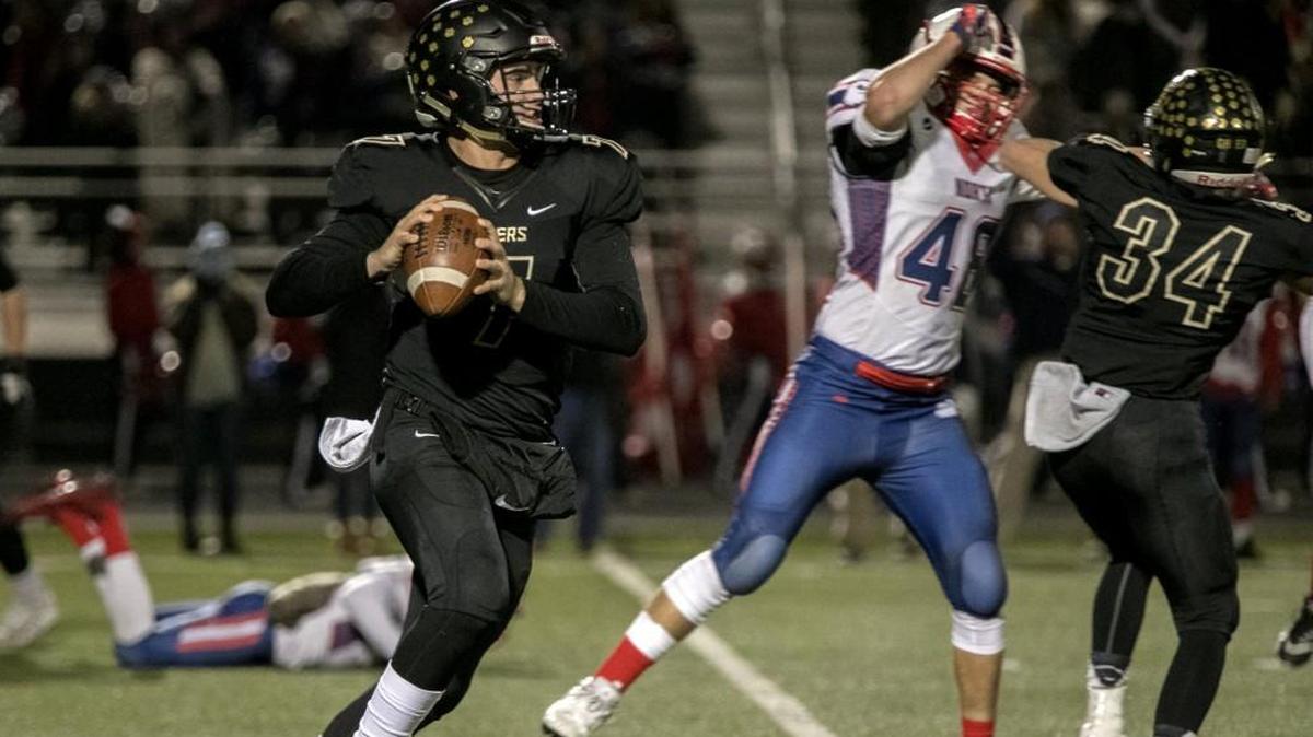 Blue Valley quarterback Walker Kinnney looked for an open receiver Friday, Nov. 10, 2017, against Olathe North. The Tigers advanced to the Class 6A semifinals with a 48-21 victory at Blue Valley.
