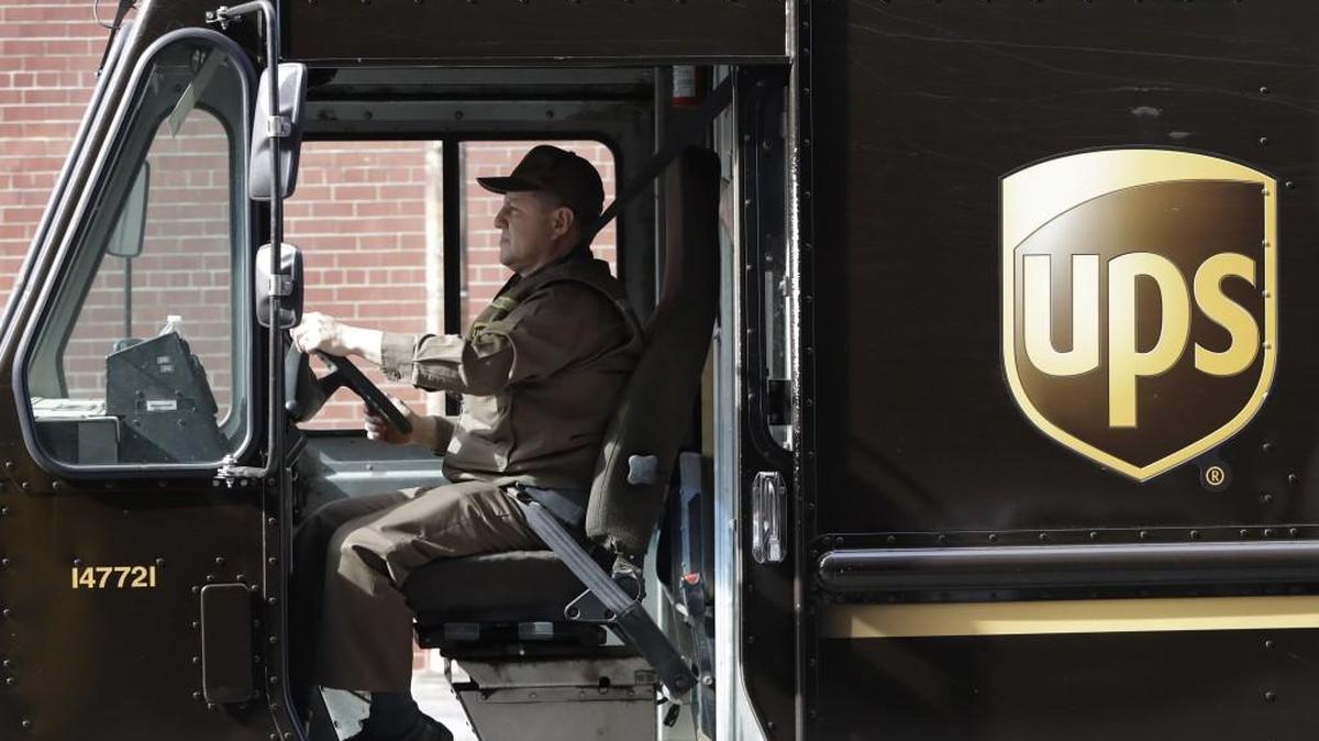 A UPS driver takes his truck on a delivery route. The company has begun construction on an expansion of its Lenexa facility at 14650 Santa Fe Trail Drive that will double the size of the current facility.