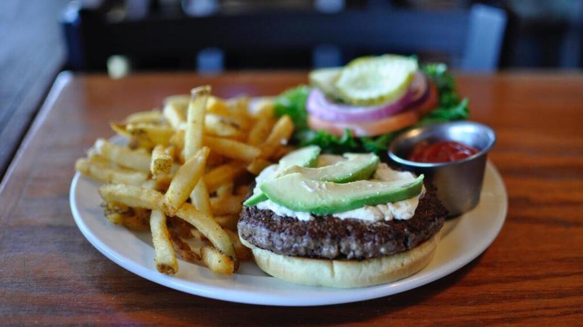 
Callahan’s on 87th is known for burgers such as the Cali Burger ($9.29), topped with cream cheese and avocado. It’s served with hand-cut fries, pub chips, slaw or cottage cheese.
