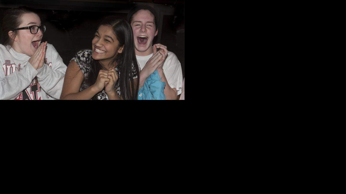 
After being named the winner of the Lifetime television show “Child Genius,” Vanya Shivashankar, 13, (center) celebrated with two of her friends, Sarah Peek (left) and Reagan Holmes, Tuesday, February 24, 2014 during a watch party for the final episode of the show at Granite City Food & Brewery in Olathe. Shivashankar, won $100,000 for college. All three girls are students at California Trail Middle School in Olathe.
