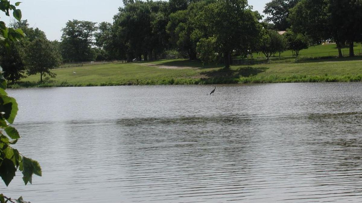 The 75-acre Cedar Lake, surrounded by 54 acres of land, is located at 15500 S. Lone Elm Road.