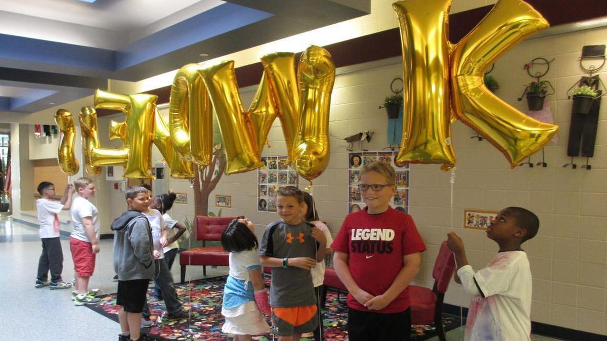Bobby McKinney, Lincoln Black, Chelsea Jenkins, Hayden Stecher, Tyler Smith, Kiyanna Herrara James, Kaden Bandy, Charlie Lawrence and Quinci Ward held balloons spelling out “kindness” for the assembly at Arbor Creek.