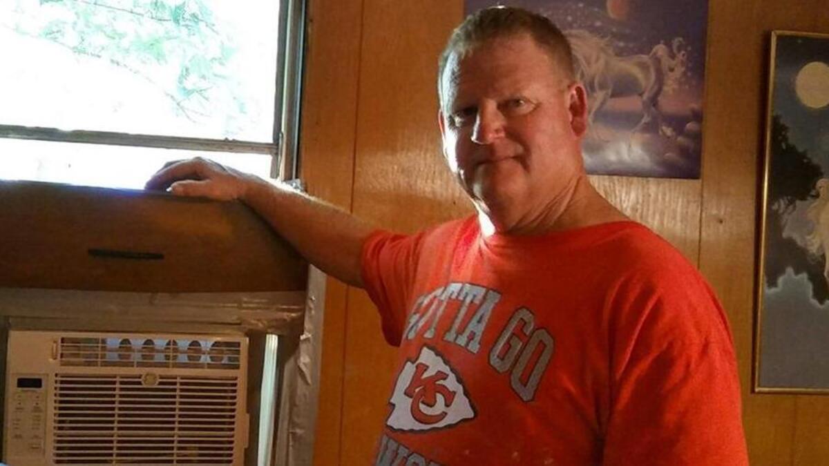 Evan Spalding installed this new window air-conditioner for a Gardner couple. Walmart donated the unit to the couple, who otherwise couldn’t afford to replace it.