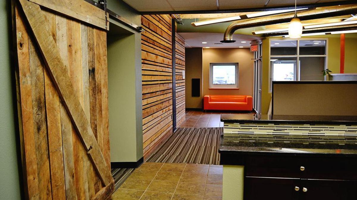 The Land Source, a real estate company, was recognized for recycling and using reclaimed lumber in a recent renovation.