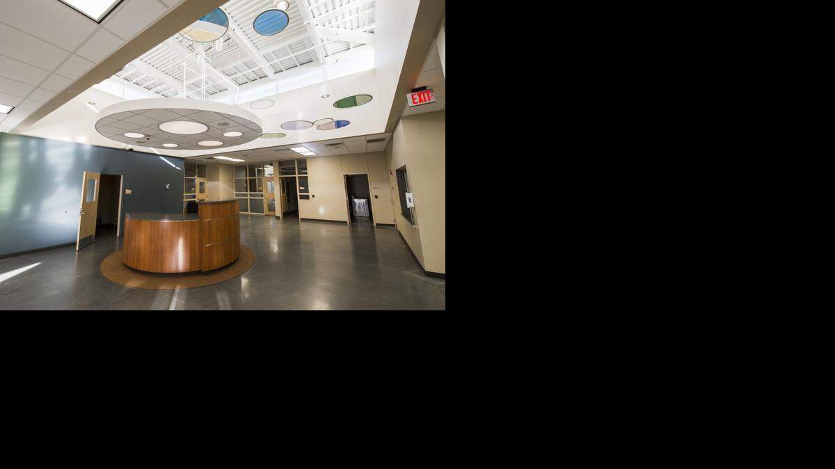 The main hall leading to the residential, classroom and meeting areas features an open, inviting atmosphere.<252><137>The main hall leading to the residential, classroom and meeting areas features a round desk during a tour of the new Youth Residential Center by the Johnson County Juvenile Corrections Advisory Board at the Youth and Family Services Center, 920 Spruce, on Friday, January 9, 2015, near Olathe, Kansas. The county opened the youth and family services center in 2011 with 33 beds for county detention but the population has been decreasing. So they decided to convert the center into less of a detention center and more of a shelter to help these kids learn how to manage their lives. It will house juvenile offenders under the state corrections supervision. In the past these kids were sent to Junction City, but the county hopes this will be better because they'll get to stay in the community and their parents can better participate in programs as well.<137><137><252><137>
