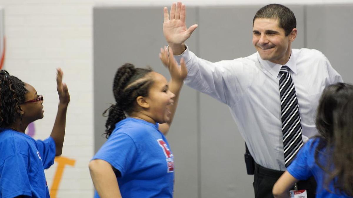 Rolling Ridge Elementary School students gave principal John Ernst high fives after the assembly.