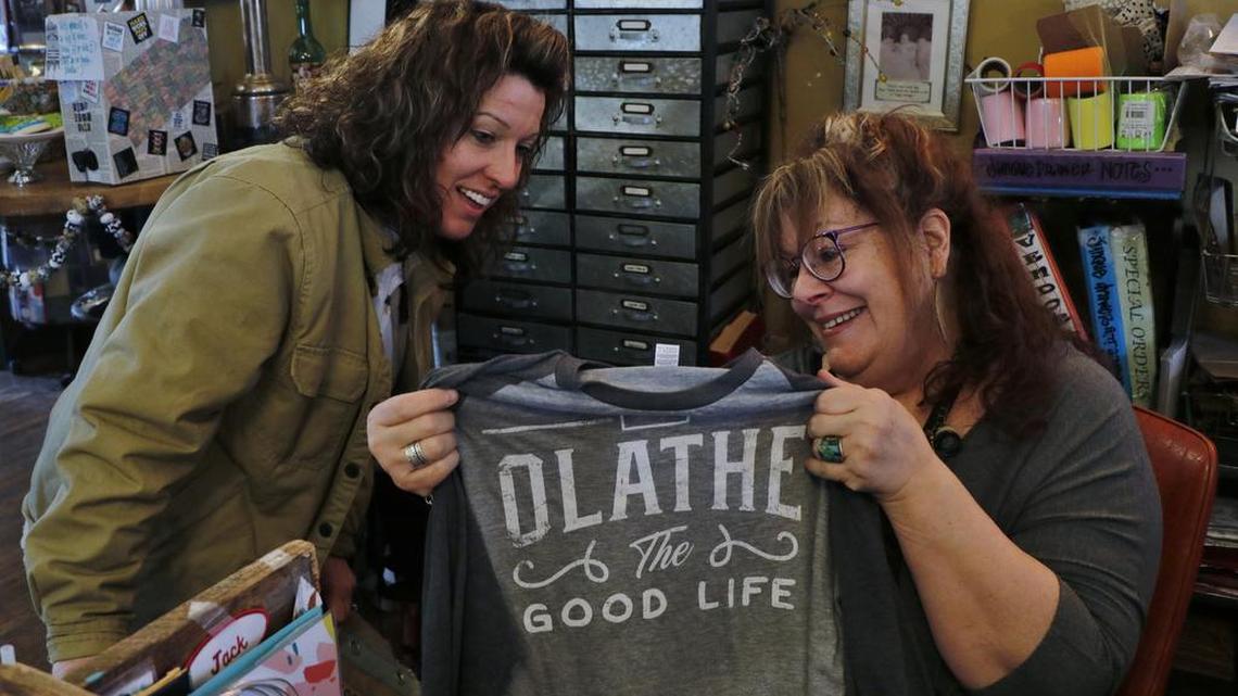 On a Saturday earlier this month, Jane Stern, right 101, helped customer Kathlene Bell select a T-shirt for a friend. “I like the uniqueness of this shop,” said Bell, who has shopped at Junque Drawer for years.