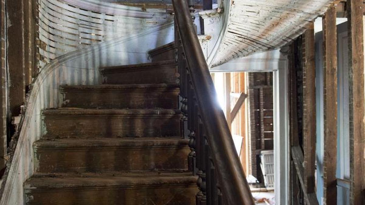 
The main stairway featured a stained glass window, which is being repaired.



