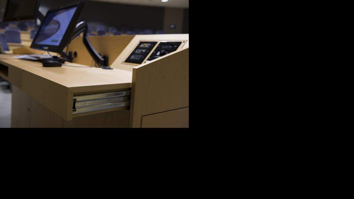 At Kansas State University’s biosciences building in Olathe, podiums have sliding tops and computer monitors on articulating arms designed to help people in wheelchairs. <252><137>Local carpenters built podiums that have a sliding top along with articulating arms attached to computer monitors to accommodate people in wheelchairs that were on display at the Kansas State University Biosciences building on Friday, February 20, 2015, in Olathe, Kansas.<252><137>
