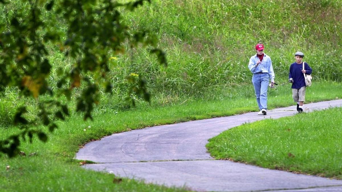 A bicyclist is suing the City of Olathe after she crashed on Meadow Lane Trail last year.