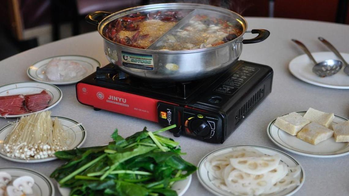 Szechuan Dynasty’s Mao-Cai Fire Pot meal comes with the customer’s choice of beef, fish, vegetables and other traditional accompaniments. The ingredients are cooked in a pot of simmering broth.