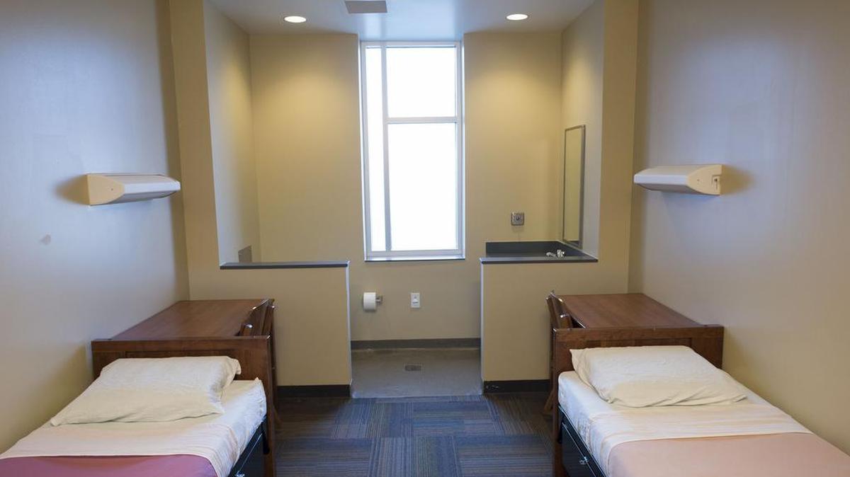 The sleeping quarters for youth during a tour of the new Youth Residential Center by the Johnson County Juvenile Corrections Advisory Board at the Youth and Family Services Center, 920 Spruce, on Friday, January 9, 2015, near Olathe, Kansas. The county opened the youth and family services center in 2011 with 33 beds for county detention but the population has been decreasing. So they decided to convert the center into less of a detention center and more of a shelter to help these kids learn how to manage their lives. It will house juvenile offenders under the state corrections supervision. In the past these kids were sent to Junction City, but the county hopes this will be better because they’ll get to stay in the community and their parents can better participate in programs as well. The majority of the rooms are double occupancy and privacy curtains are schedule to be installed before the facility opens.