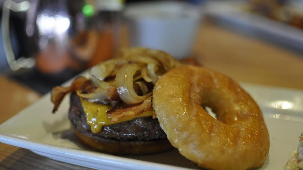 Red Door Woodfired Grill’s burger of the month is a doughnut burger that tops a Lamar’s doughnut with a McGonigle’s beef patty, grilled onions, cheddar and bacon. The burger costs $12 and is available through the end of April.