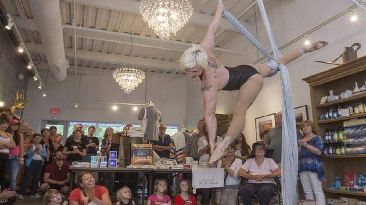 Aerialist Rachel McMeachin, founder of Voler-Thieves of Flight Performance Ensemble, took part Friday in HipHopCatWalkAerialPlie, a dance showcase in downtown Overland Park. The General Store was a site for the event.<252><137> of during HipHopCatWalkAerialPlie in downtown Overland Park. Spear headed by InterUrban ArtHouse, in partnership with Johnson County Community College, the Downtown Overland Park Partnership and local merchants, HipHopCatWalkAerialPlie, showcased dance performances from popping to classical ballet.<137><137><252><137>