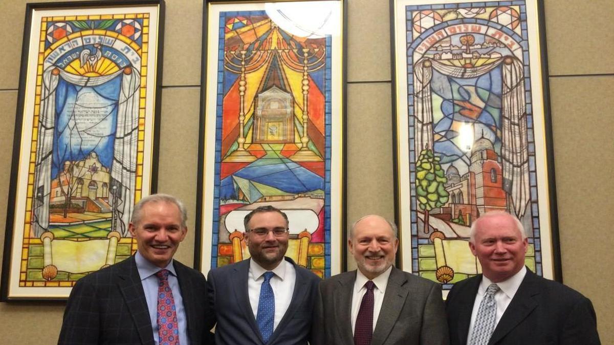 Recovered artwork was turned over recently to Congregation Beth Shalom. At the presentation were (from left) Greg Graves, CEO of Burns & McDonnell; Norman Kahn Jr., president of Congregation Beth Shalom; Rabbi David Glickman of Beth Shalom; and Dave Harrison, president of VanTrust.
