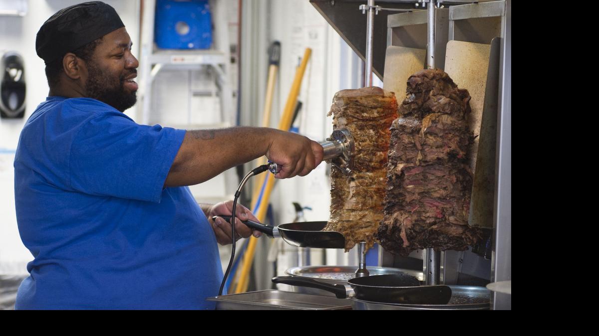 
Paul Lewis cut meat for gyros at Pita Blu in Overland Park.
