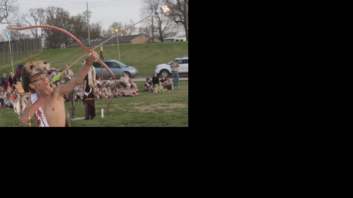 
Dillion Drahota of Troop 10 shot a flaming arrow over the lake at Moriah Campground, 10507 Holmes Road in Kansas City, signaling the beginning of the Order of the Arrow ceremony Saturday.


