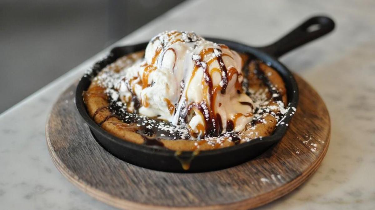 Decadent’s bestselling menu item is a warm chocolate chip cookie served in a hot cast iron skillet with vanilla bean ice cream, hot fudge and caramel.