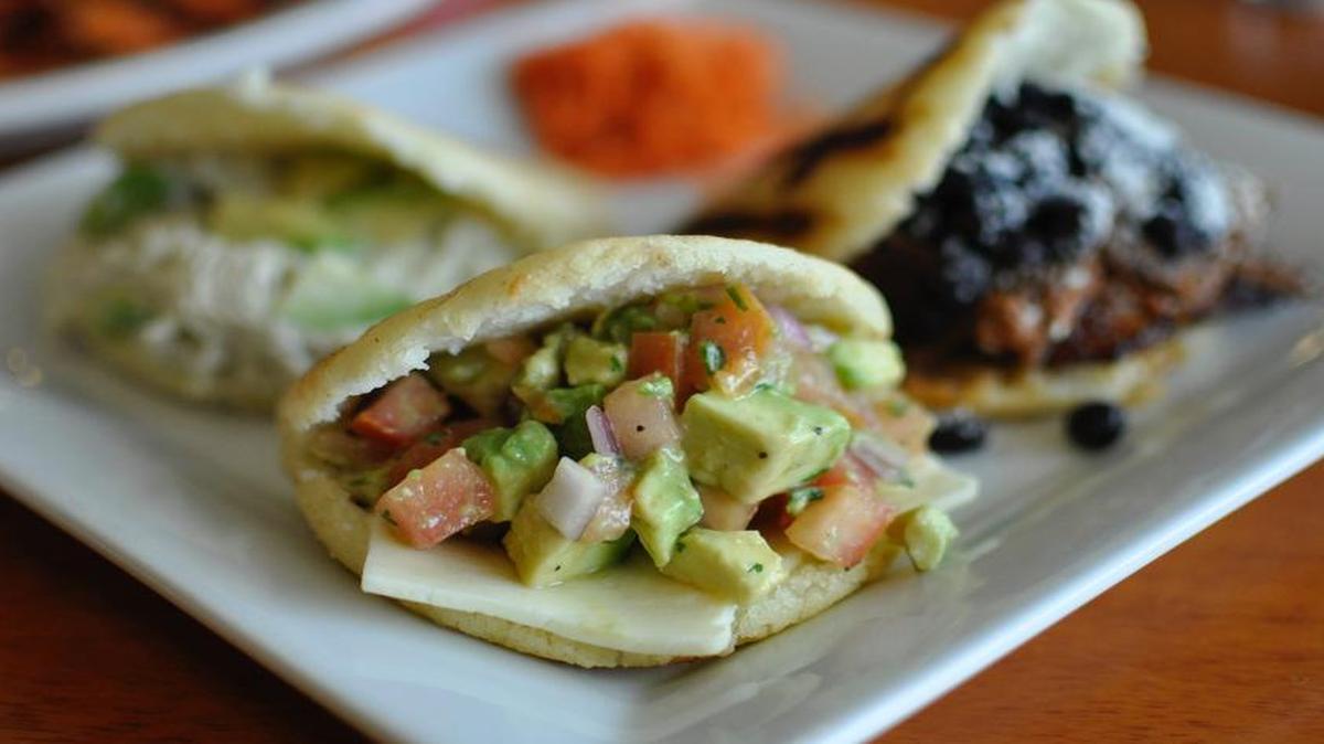 Venezuelan arepas are the specialty at El Porton Cafe in Overland Park. The savory corn cakes are stuffed with fillings such as (from left) chicken salad, guacamole and shredded beef with black beans.