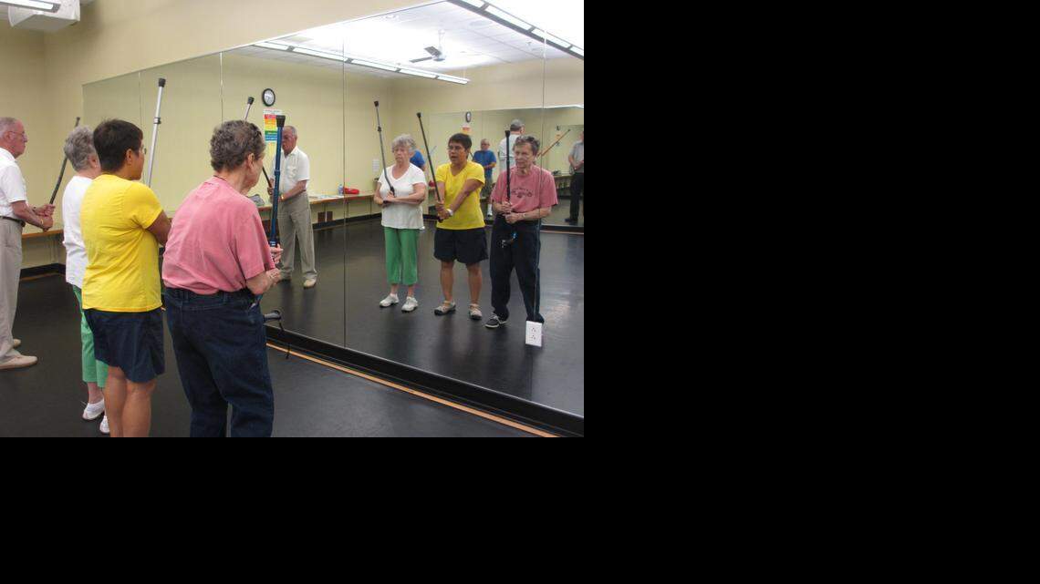 
Instructor Bennie Bolton demonstrates to Clifford Rovelto, Joanne Cohen and Beverly Westvold how to balance standing without a cane.
