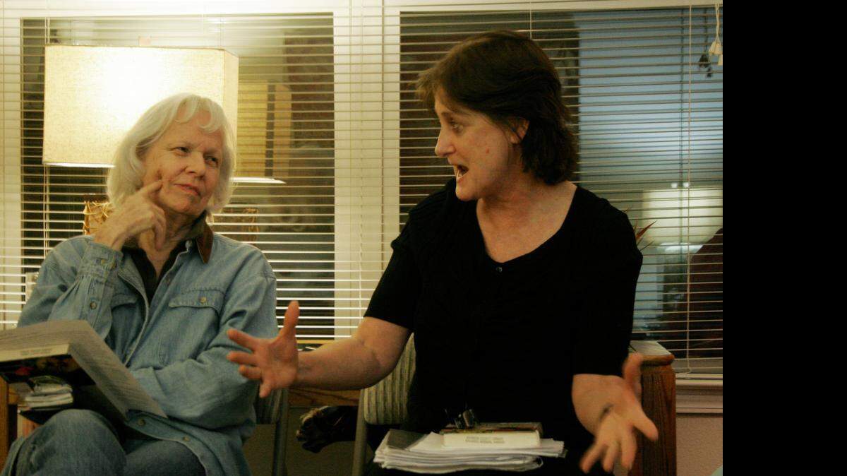 
Debbie Fowler discusses a point in “The School of Essential Ingredients” with Helen Yeomans (left).
