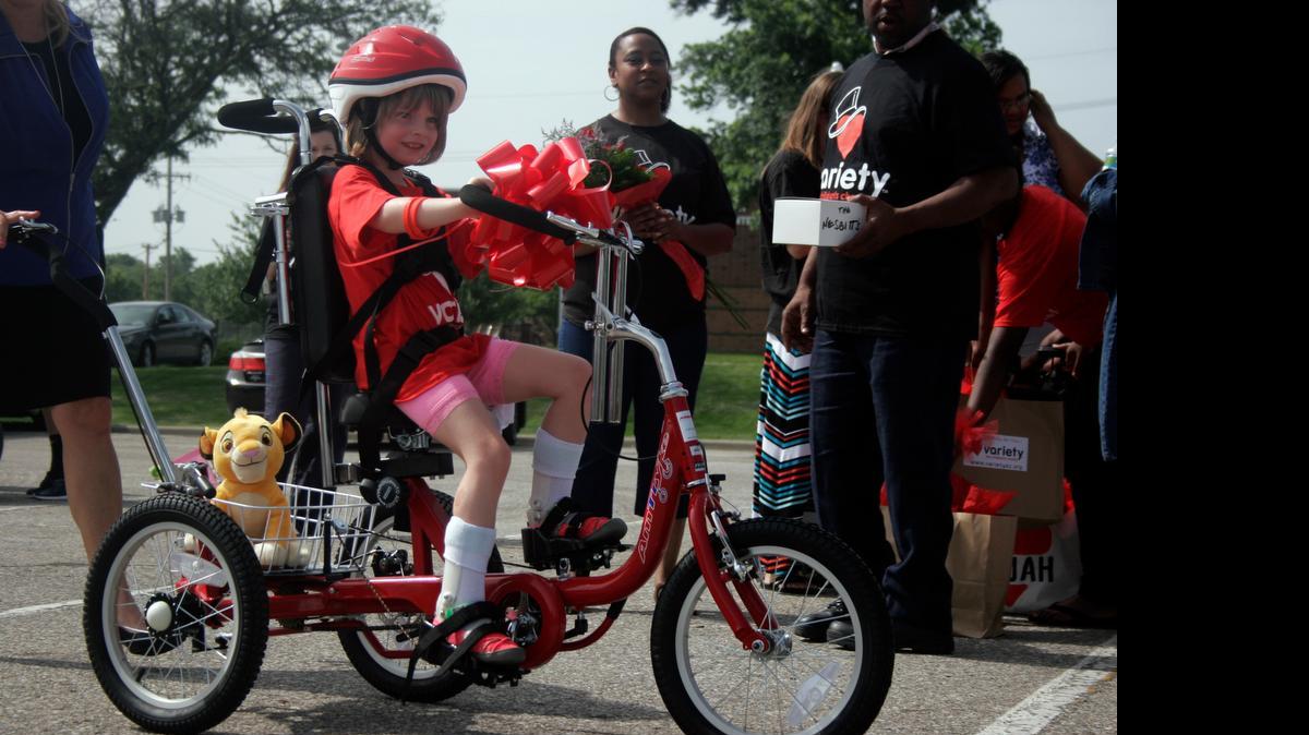 
Five-year-old Dixie Huddleston takes her new bicycle for a spin. The bicycle’s design allows kids to get exercise, even if they still need an extra push from an adult.

