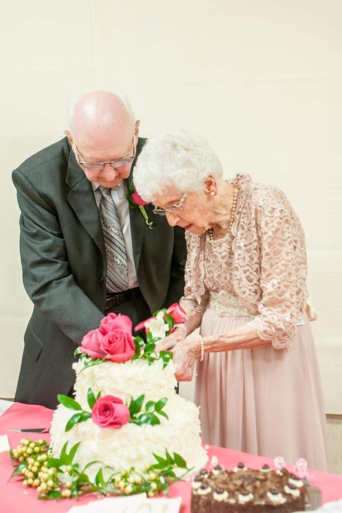 Kenneth and Carolyn Tebow cut the cake at their 75th wedding anniversary celebration and first-ever wedding reception June 23 at Old Mission United Methodist Church in Fairway, Kan.