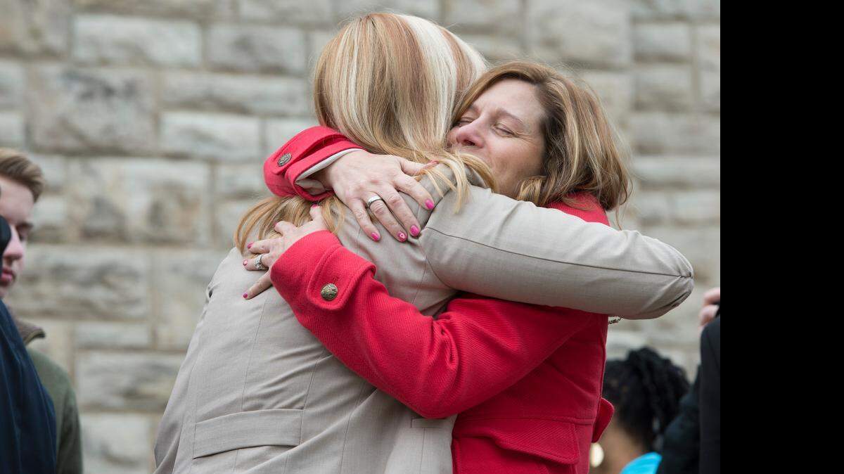 
A series of recent events marked the first anniversary of the April 13, 2014, shootings at Jewish facilities that shocked the Kansas City area. Mindy Corporon — the mother and daughter of shooting victims — decided to take action. She and others outlined what would become Seven Days: Make a Ripple, Change the World, a series of events held this month. “I have a purpose in showing people that there is going to be evil in the world and we have to shine light on it,” Corporon says. Here Corporon (right) hugged Tammy Ruder after a memorial mass at St. Peter’s Church in Brookside on Monday, April 13.
