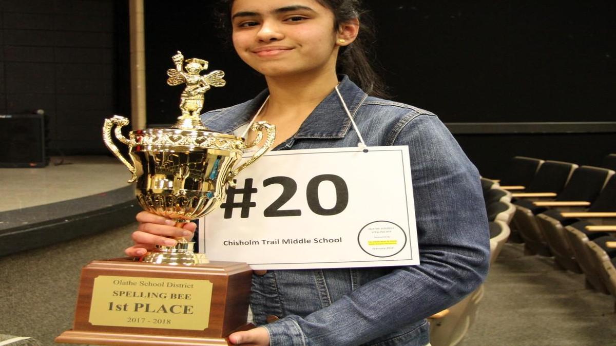 Chisholm Trail Middle School eighth-grader Nicole Patrao showed off the first-place trophy Feb. 8 after winning the Olathe Public Schools Spelling Bee at Frontier Trail Middle School in Olathe.