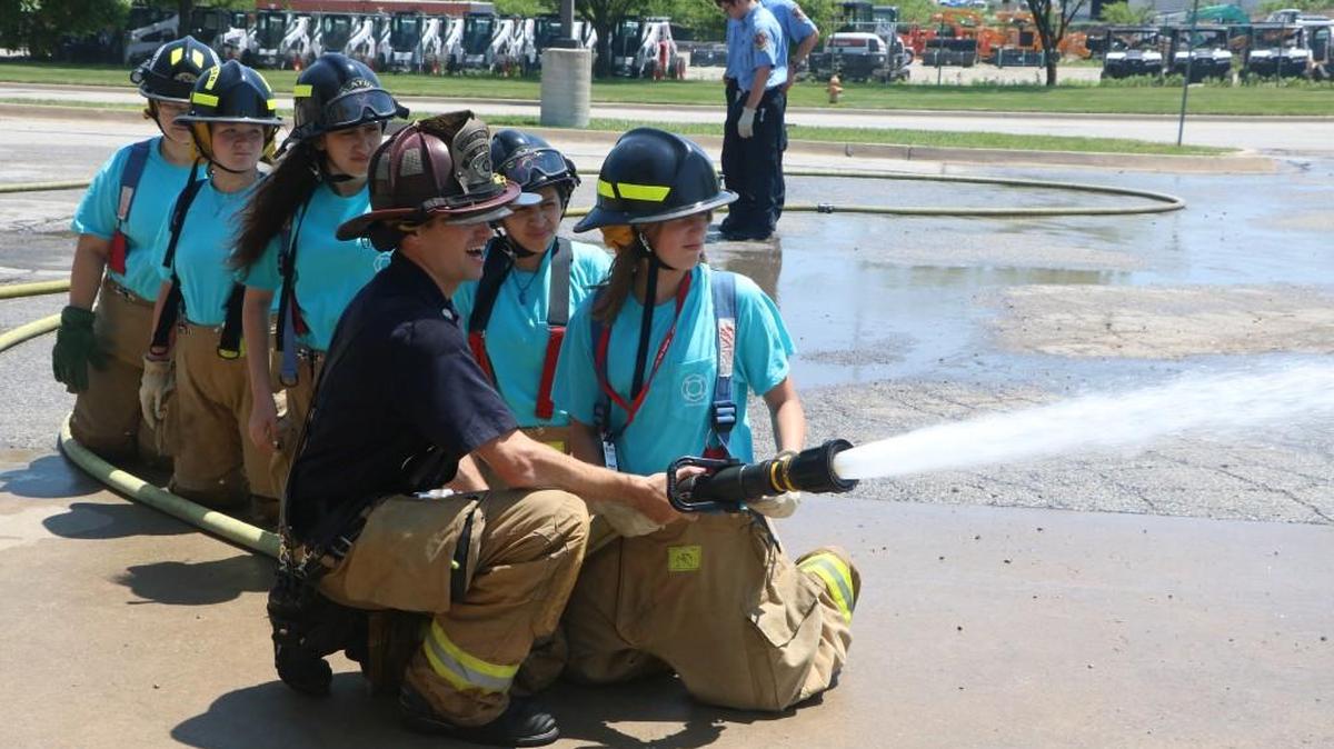 With the instruction of firefighter,Tyler Rawley, a team of future (and possibly future) firefighters practiced hoseline operations on Saturday during Olathe Fire Department’s Hero Day.