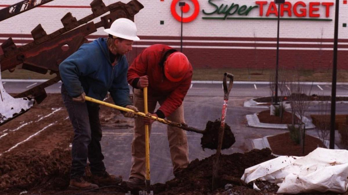 Capital Electric workers install a street light at Maurer Road and Shawnee Mission Parkway near a Super Target. City leaders have long wanted to develop a site on the southwest corner of the interesection because it is the last corner near Interstate 435 that is already filled with other shopping areas.