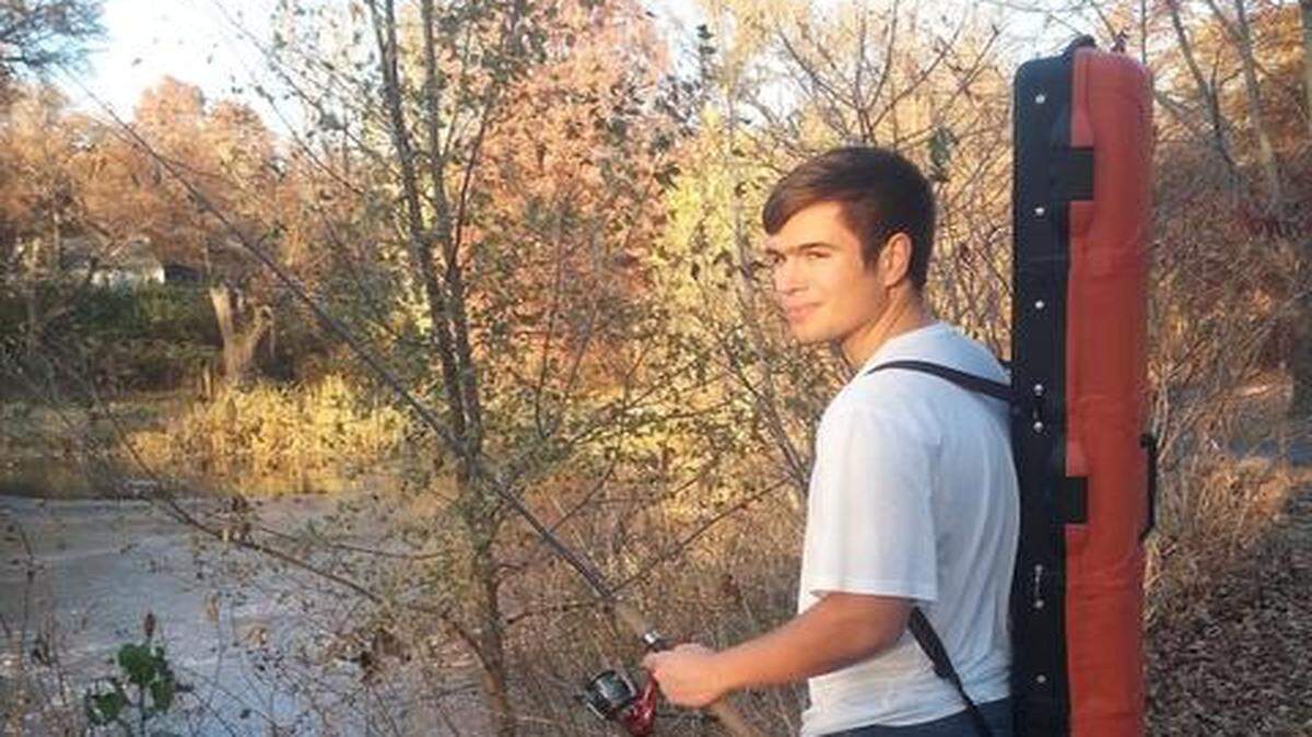 Corben Tannahill wearing “Angler’s Friend,” his invention to efficiently carry fishing equipment.