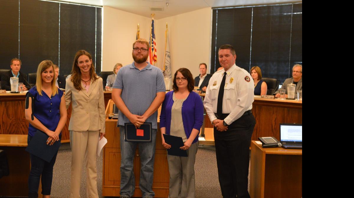 
Shawnee Mayor Michelle Distler (second from left) and Fire Chief John Mattox (right) recognized Jessica Daale (from left), Brandon Humble and Katherine Humble for their actions at a fire scene May 14.
