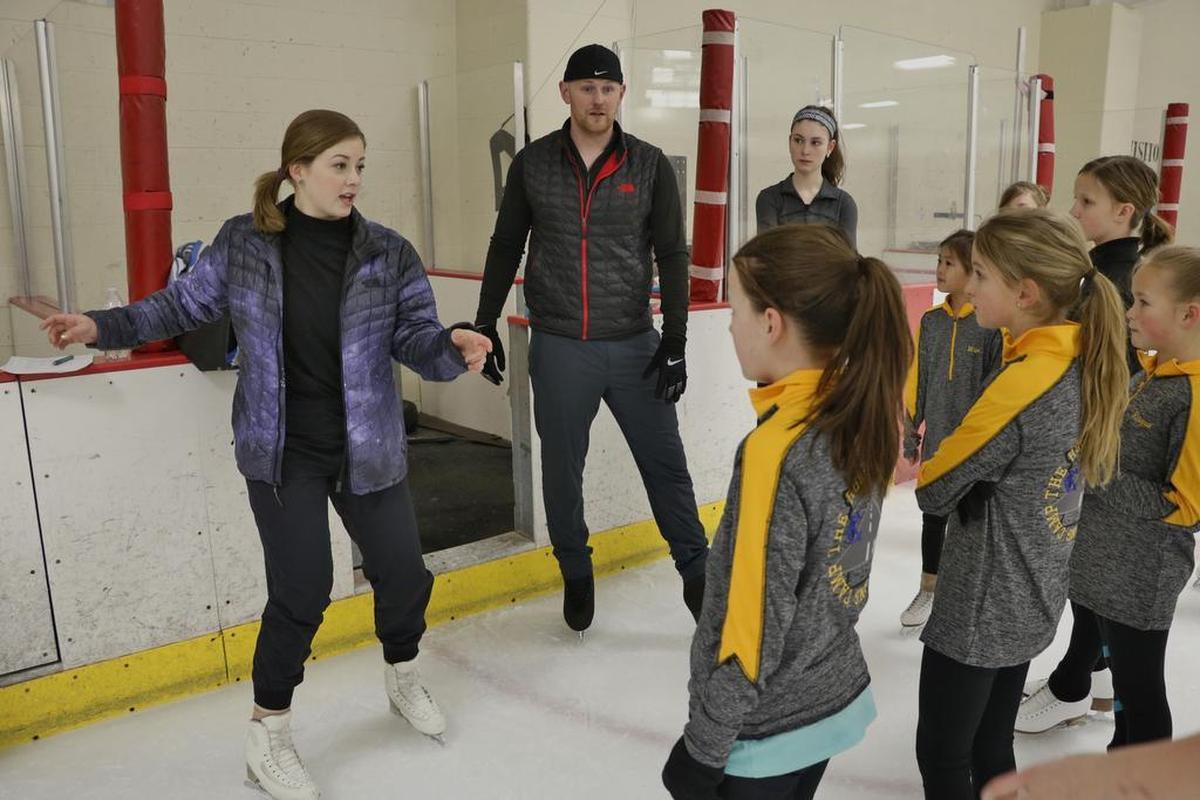 Olympic bronze medalist Gracie Gold (left) and former U.S. pairs champion John Coughlin discussed spin techniques with participants at the two-day Road to Gold Training Camp last year at the Line Creek Ice Arena. Organized by Coughlin, the clinic offered participants the chance to learn championship-level practices and techniques.