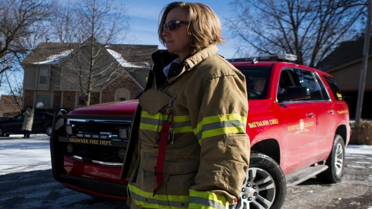 Female firefighters make up just 5 percent of firefighters nationwide, but fire departments are hoping to increase those numbers. Among the female firefighters in local fire departments is Battalion Chief Julie Harper of the Overland Park Fire Department; she’s been with the department for a quarter of a century. Here she observes firefighting operations from a command post after an Overland Park crew responded to a recent house fire in Shawnee.