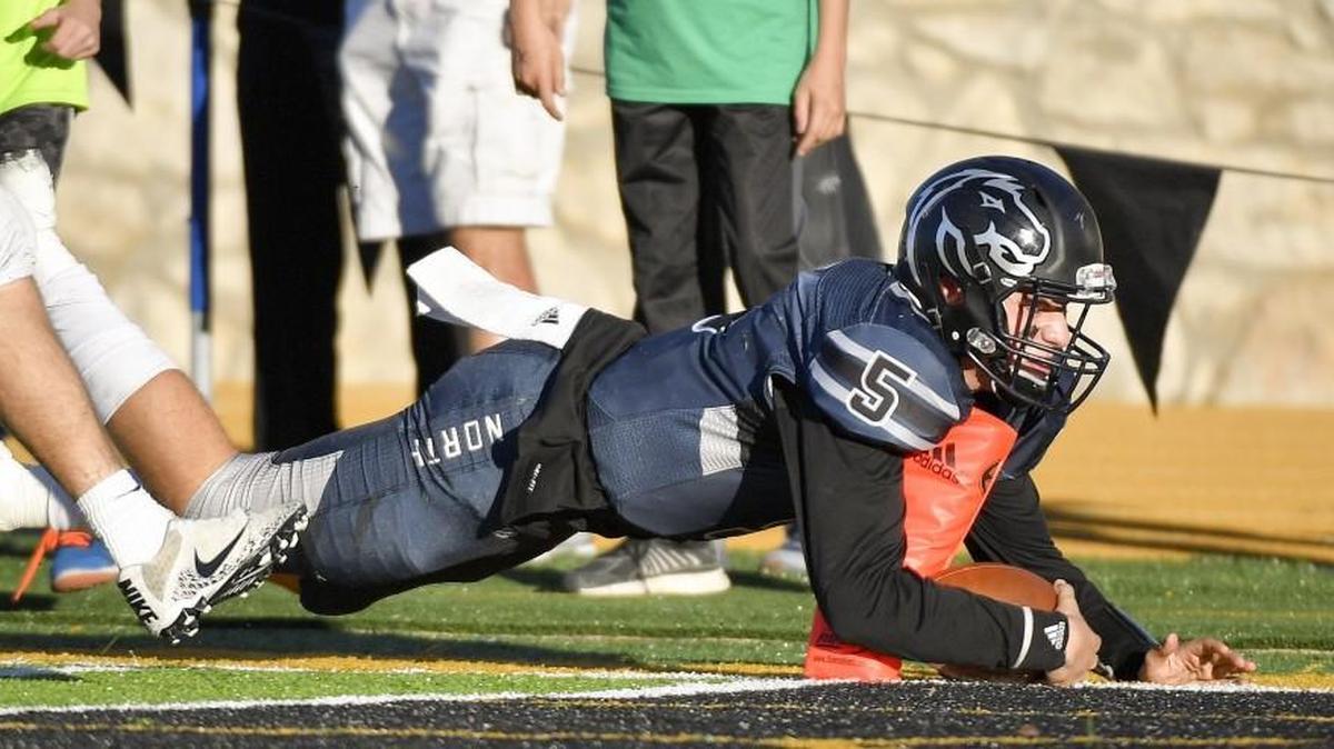 Blue Valley North quarterback Graham Mertz scored the game-winning touchdown during the final minute of the Mustangs’ 49-42 victory against Derby in the Class 6A state championship Saturday, Nov. 25, 2017, at Emporia State University.