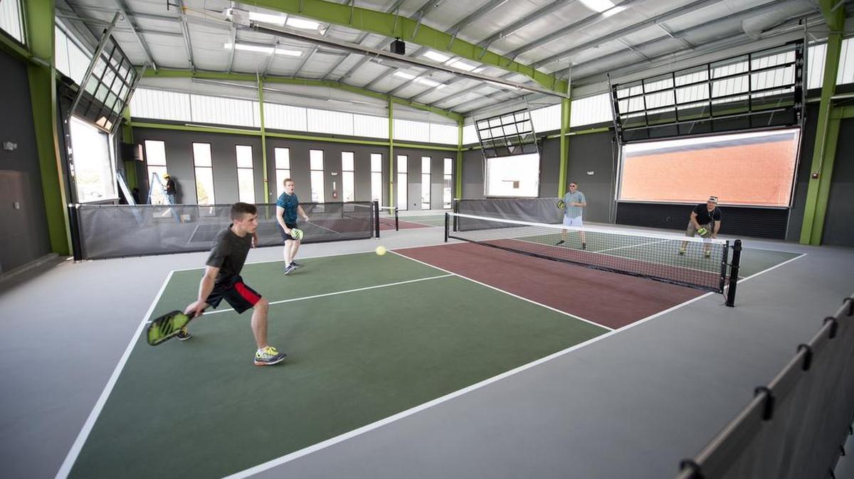 In June, Jack Goza and Mike Zee of Overland Park played Bill Koning of Olathe and Alex Staab of Kansas City at the Chicken N Pickle in North Kansas City. The complex has indoor and outdoor pickleball courts. There is a concession stand for patrons to cool down during and after their games, and other outdoor games are also available.