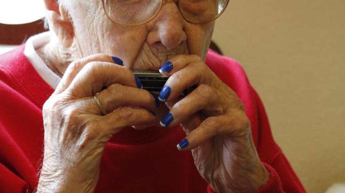 Dorothy Plummer, 103, played a harmonica recital for her fellow memory-care residents Tuesday, Nov. 28, 2017, at Brookdale College Square in Overland Park. Her performance coincided with the end of National Alzheimer’s Disease Awareness and Caregivers Month, which takes place each November.