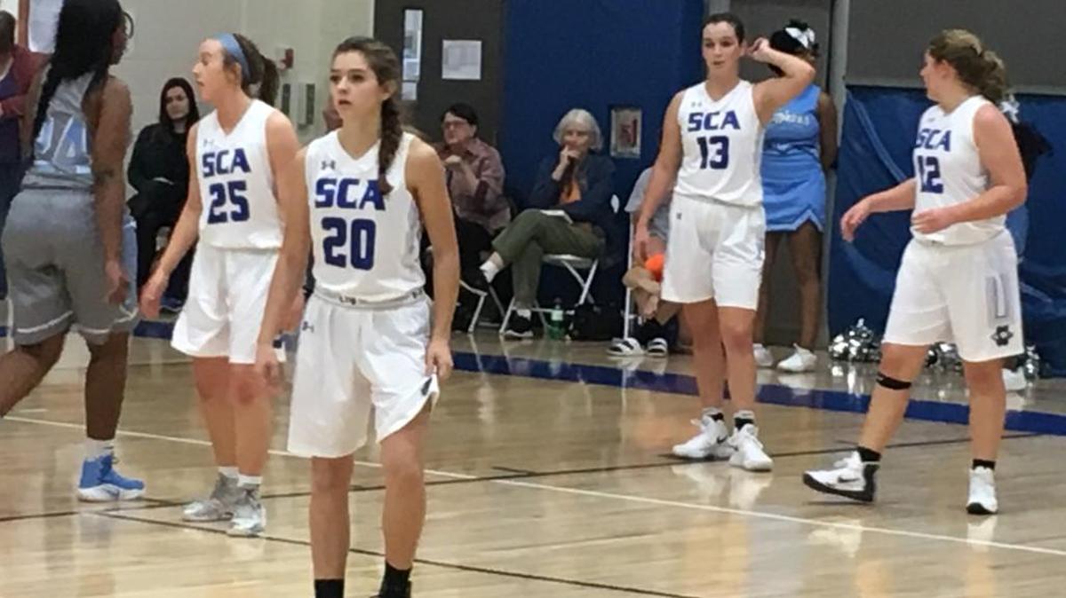 Summit Christian Academy players (from left) Grace Glidewell, Rylee Lunn, Alyssa Pemberton, and Payton Sprouse waited at the defensive end Monday, Nov. 27. 2017, as University Academy brought the ball up the floor durin the first round of the Eagle Invitational. Summit Christian, which is hosting the tournament, won 54-40.