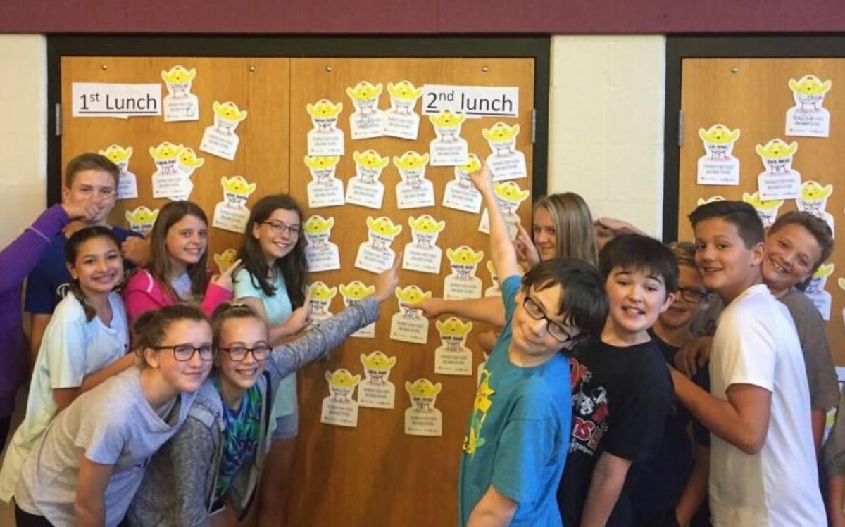 The second lunch shift at Bernard Campbell Middle School purchased 22 chicks for needy families outside the United States. Pictured are several students from that shift.