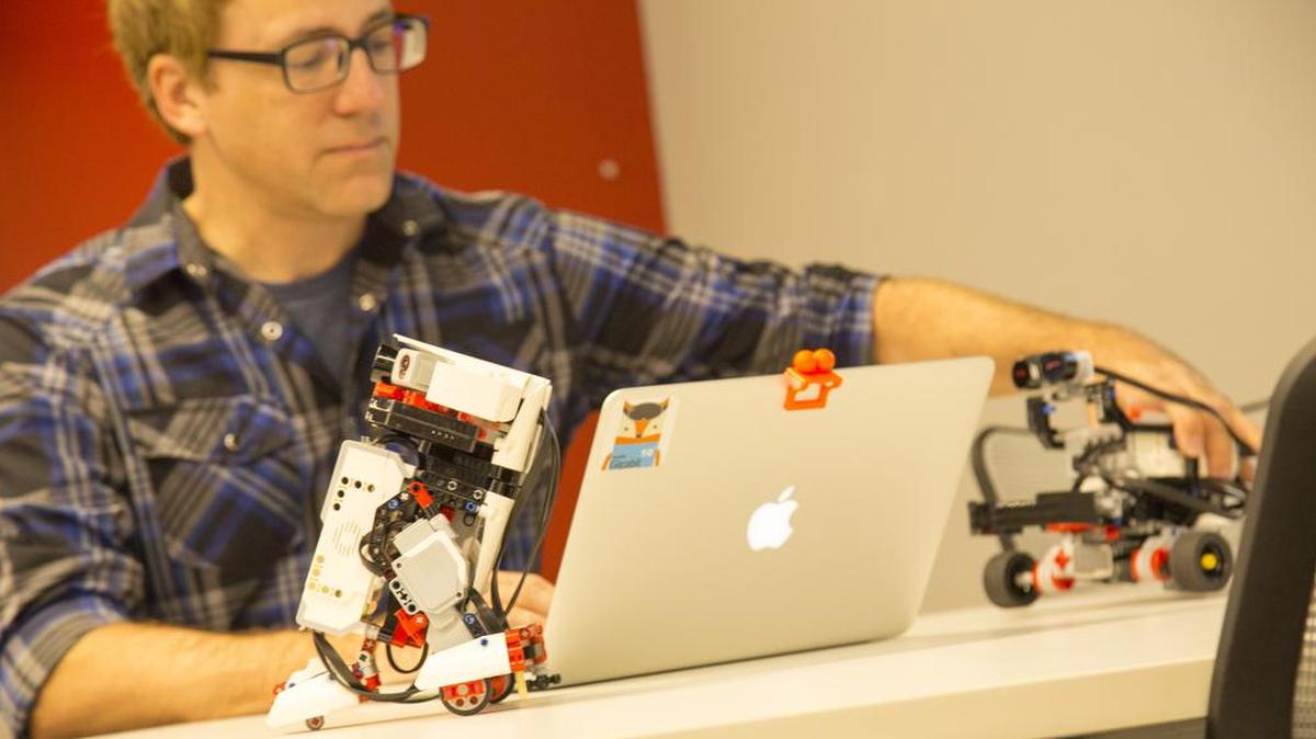 Jonathan Wagner, founder of Big Bang IO, LLC, demonstrates Gigabots, which are designed for K-12 students to explore robotics and Internet of Things applications, and will be part of the new Gigabit lab at The Missouri Innovation Campus.