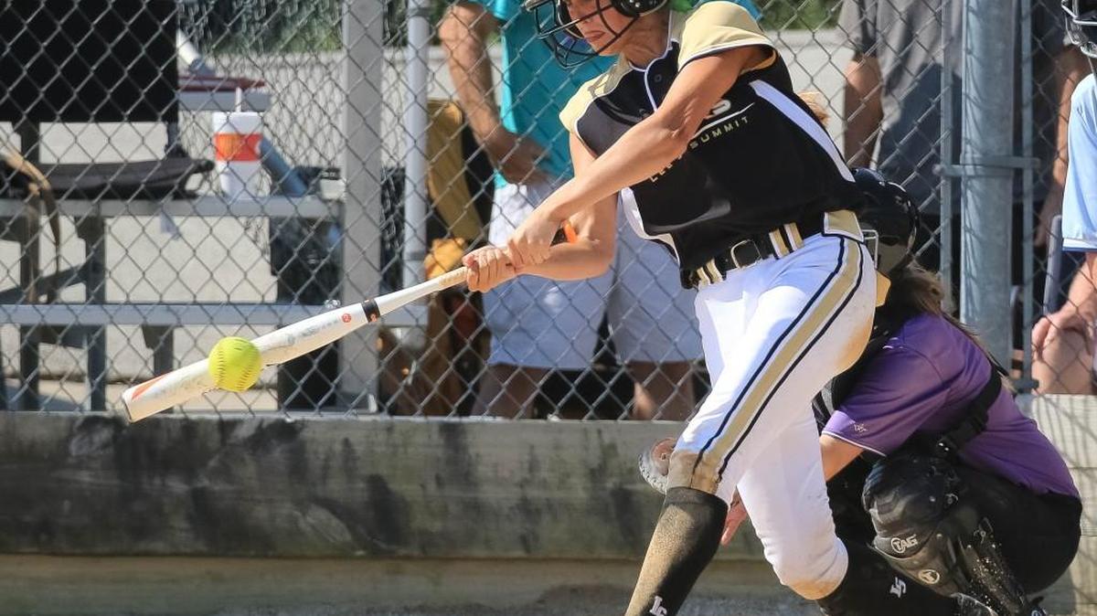 Ashlynn Cook of Lee’s Summit connects with a pitch during the Tigers game against Notre Dame de Sion Saturday in the Greater Kansas City Suburban Softball Invitational. Cook is one of three returning starting seniors for the Tigers