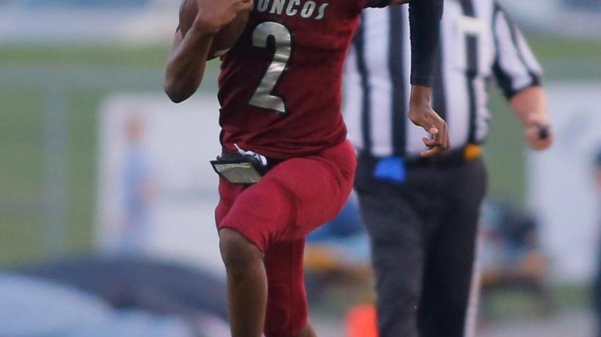 Lee’s Sumit North quarterback Christian Carter breaks loose for a long gain Friday night against Blue Springs South. Carter rushed for 172 yards and a touchdown in the Broncos’ 29-16 victory.