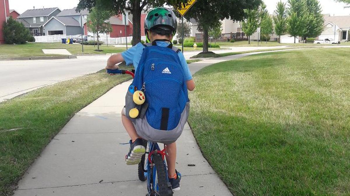 Jackson Wichman, the author’s son, knows the safety rules as he bikes to school.